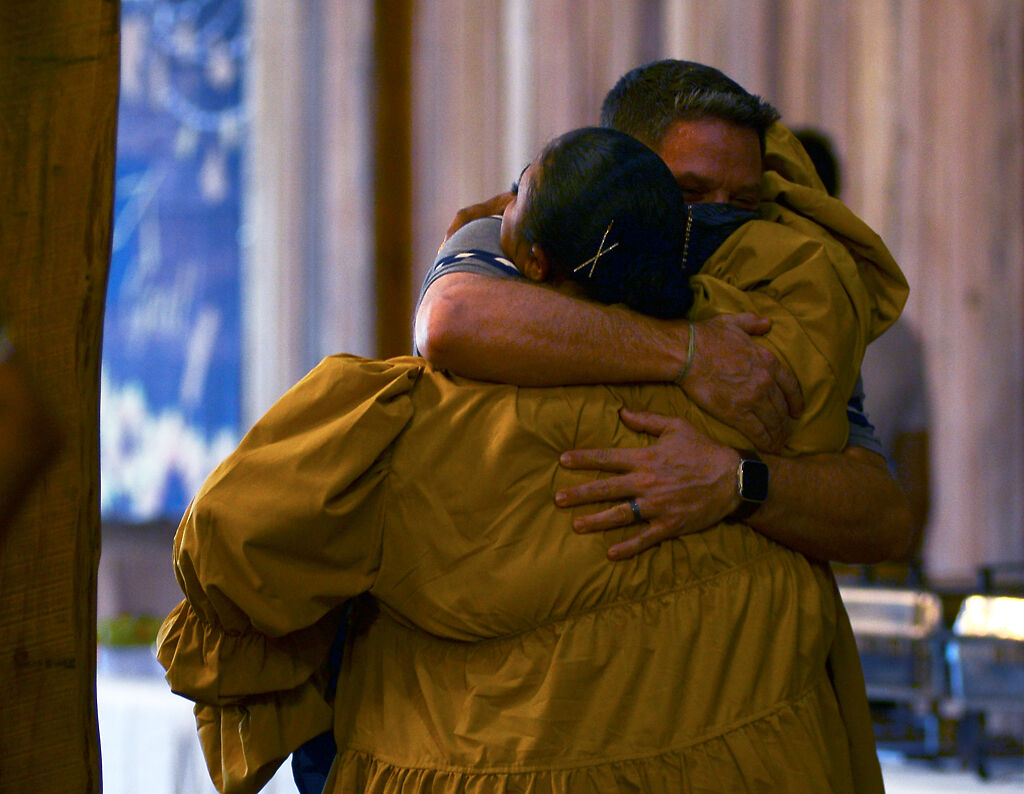 Tyus Monroe hugs Todd Maher
